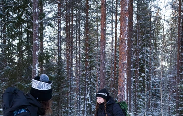 Group snowshoeing on the frozen sea in Oulu