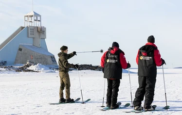 Group snowshoeing on the frozen sea in Oulu