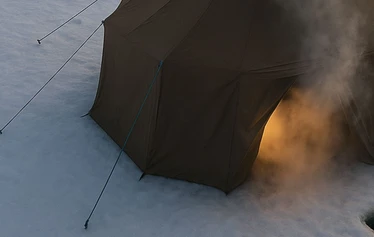 Wood-heated tent sauna on the frozen sea in Oulu