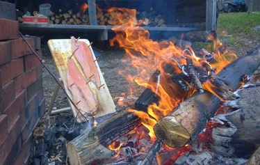 Angler catching a northern pike on a private river expedition in Molkojärvi, Lapland