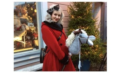 Riding a hobby horse in town of Porvoo during christmas market