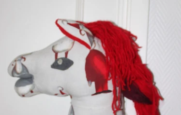 Riding a hobby horse in town of Porvoo during christmas market