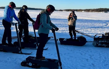 Guide opens the trail by "Snow-dog" for eLyly snow scooters