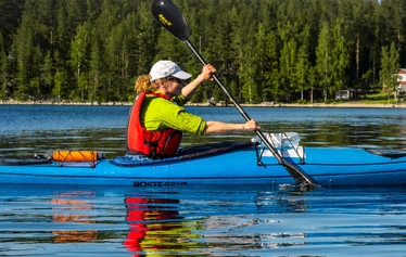 A kayaking trip on the crystal-clear waters of Lake Puruvesi - Explore the pristine waters of Lake Puruvesi on a scenic kayaking adventure in Kesälahti, Kitee, North Karelia.