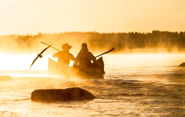 At Haapakoski Rapids - A stunning sunrise and the first rapid of the Nurmijoki River ahead. Kayaks, canoes and SUP boards are available for rent from Ruukin Tupa in the village of Jyrkkä, Sonkajärvi, North Savo.