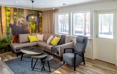 Living Room and Kitchen - At the Malmi cottage in the village of Jyrkkä, Sonkajärvi, the living room and kitchen form a bright, open-plan space.