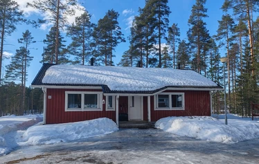 Living Room and Kitchen - At the Malmi cottage in the village of Jyrkkä, Sonkajärvi, the living room and kitchen form a bright, open-plan space.